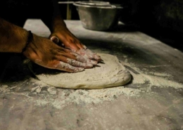 Pizza chef preparing dough in a professional kitchen